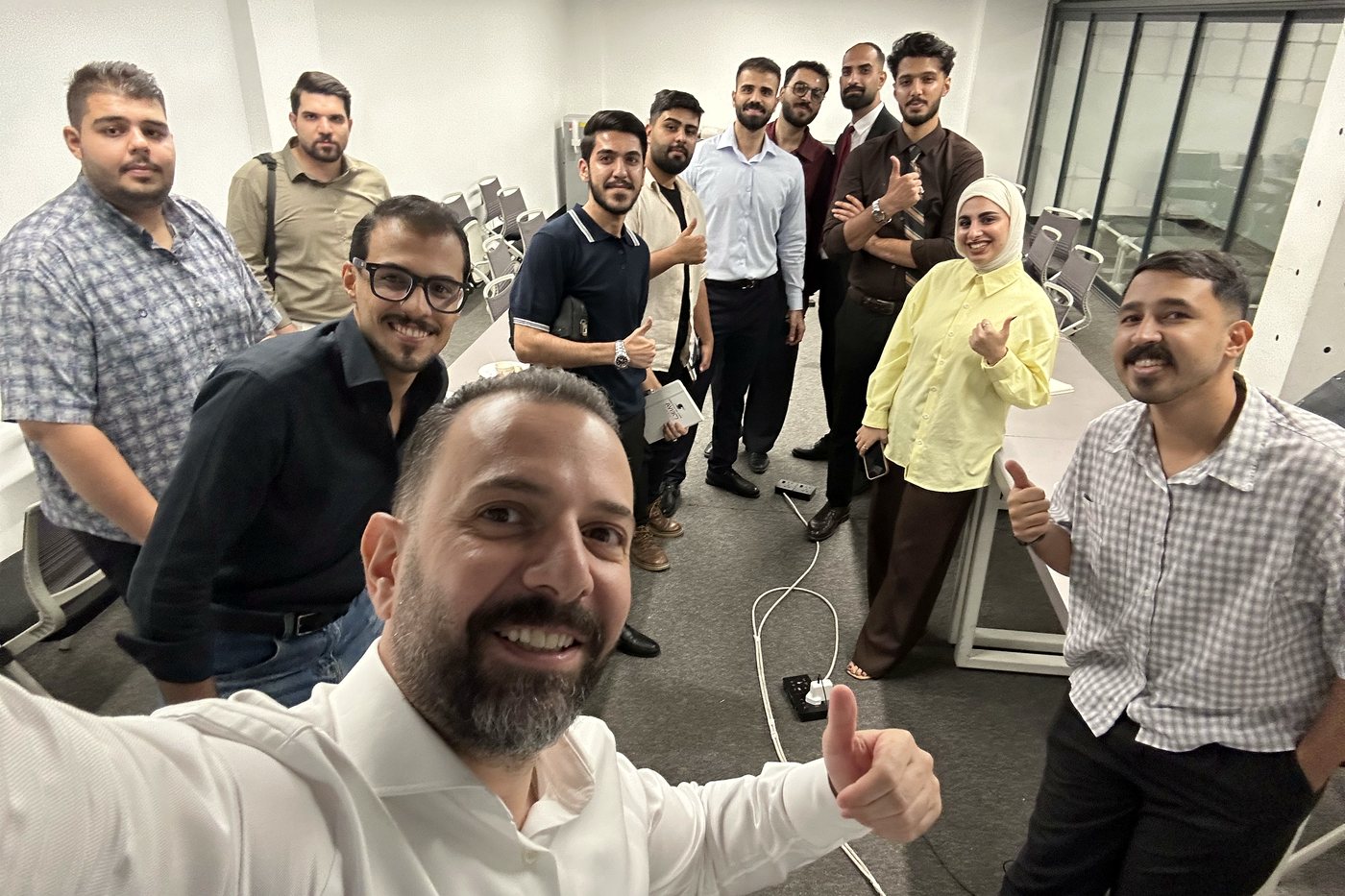 Dr. Hayder Abduljabbar with the Meiva Pharma Iraq field team in the training room in Baghdad at the close of day one