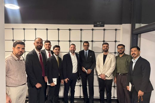The team photographed together at the venue